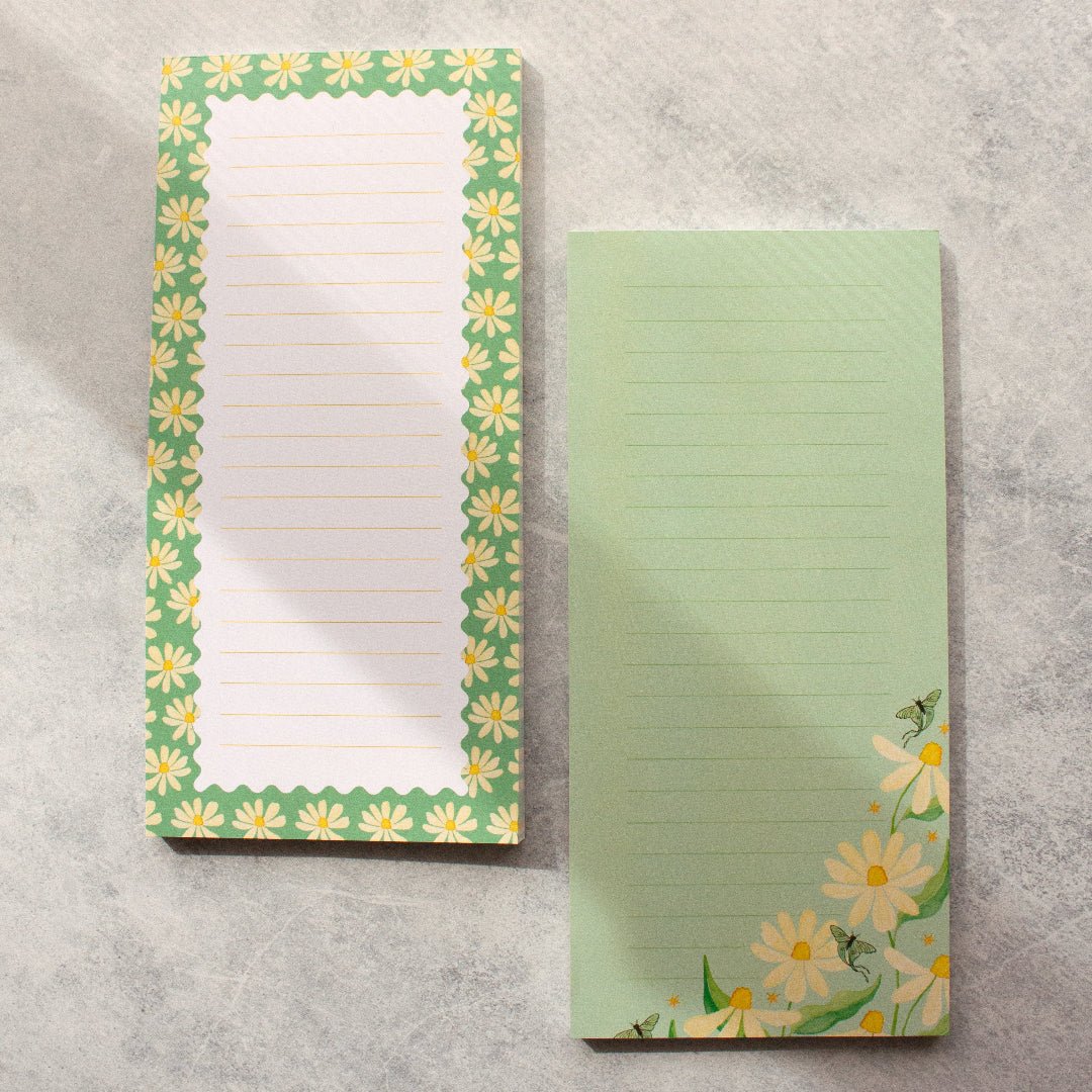 Teal DL notepad withs daisy designs, luna moths and lined pages, perfect for note-taking and stationery.
