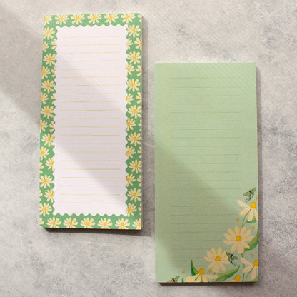 Teal DL notepad withs daisy designs, luna moths and lined pages, perfect for note-taking and stationery.