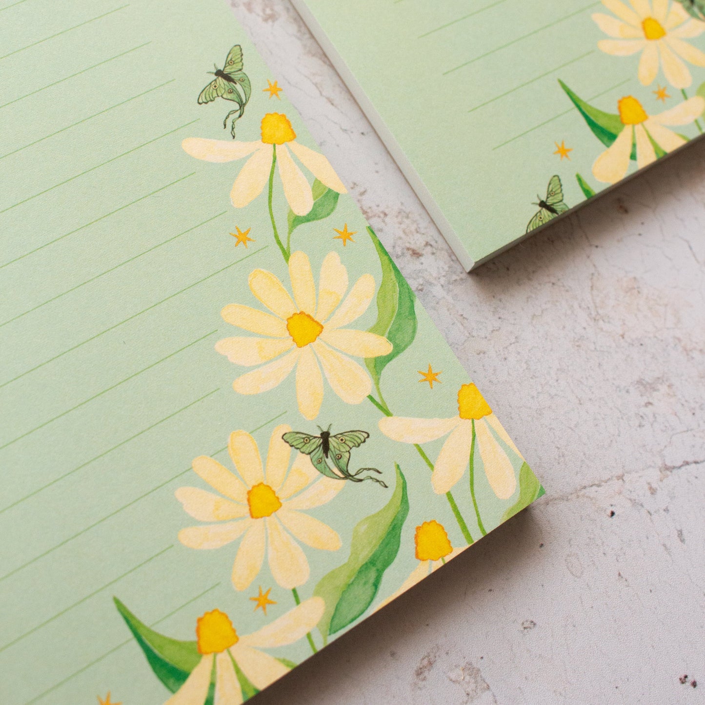 To do list notepad with floral design on a textured surface
