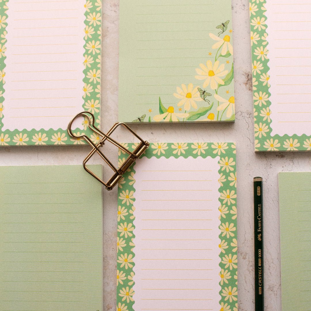 Floral teal DL notepads featuring daisies and lined pages, ideal for writing, list making, shopping lists and journaling.