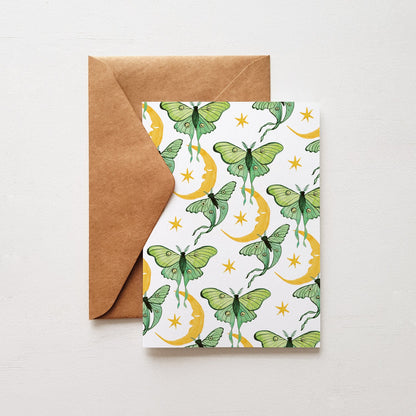 Greeting card with green moth design on a white background, accompanied by a brown envelope.