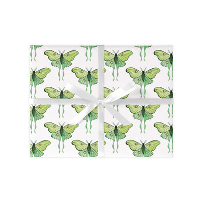 Green moth pattern on white wrapping paper