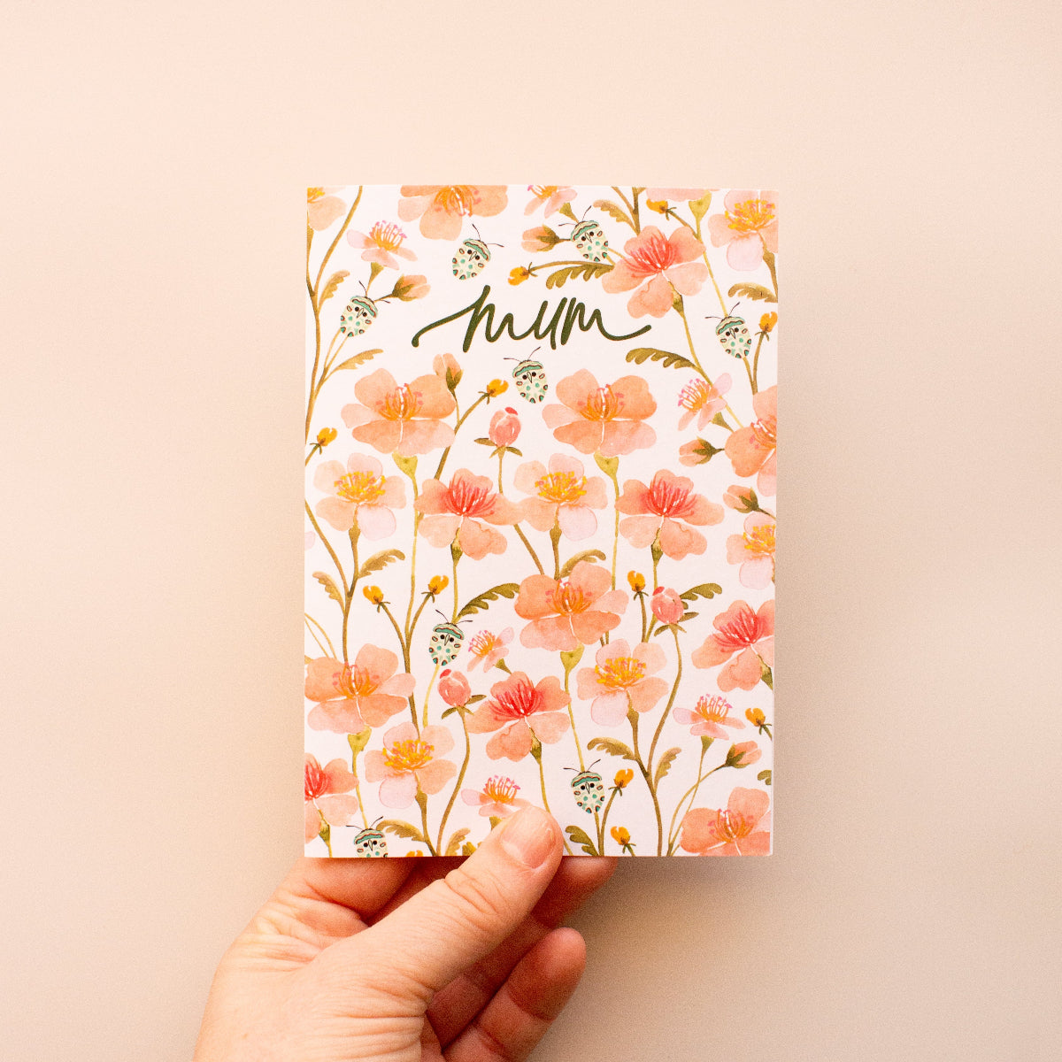 Mother’s Day greeting card with soft pink floral design and Mum lettering
