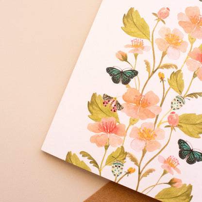 Close-up of watercolour floral detail on elegant newlyweds greeting card.