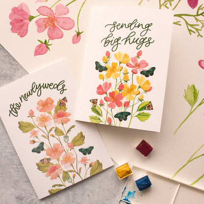 Elegant wedding stationery featuring floral watercolour newlyweds card