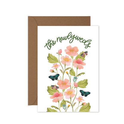 Handmade wedding greeting card for newlyweds with watercolour floral artwork and envelope.
