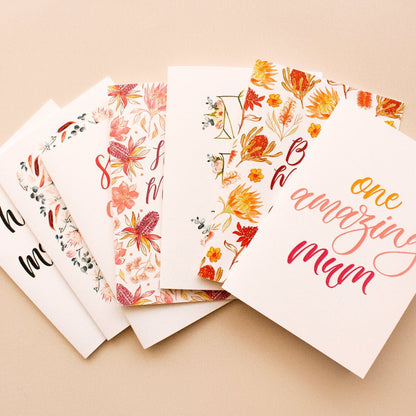 Set of mum greeting cards with floral and text designs on a beige background