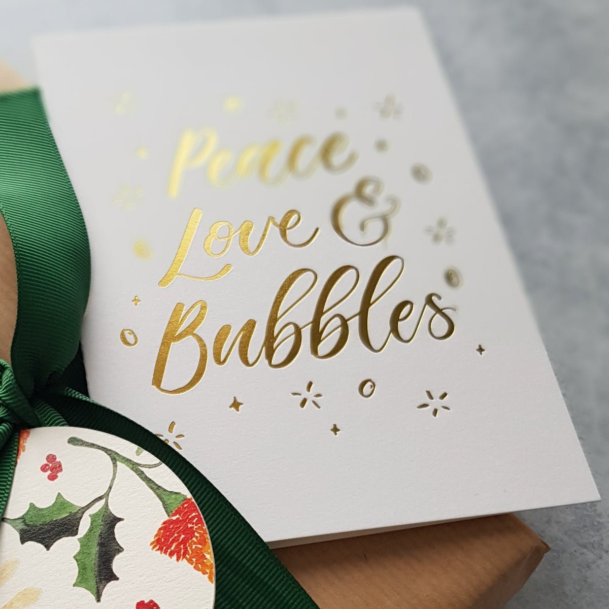 Close up of gold foil details of a christmas greeting card