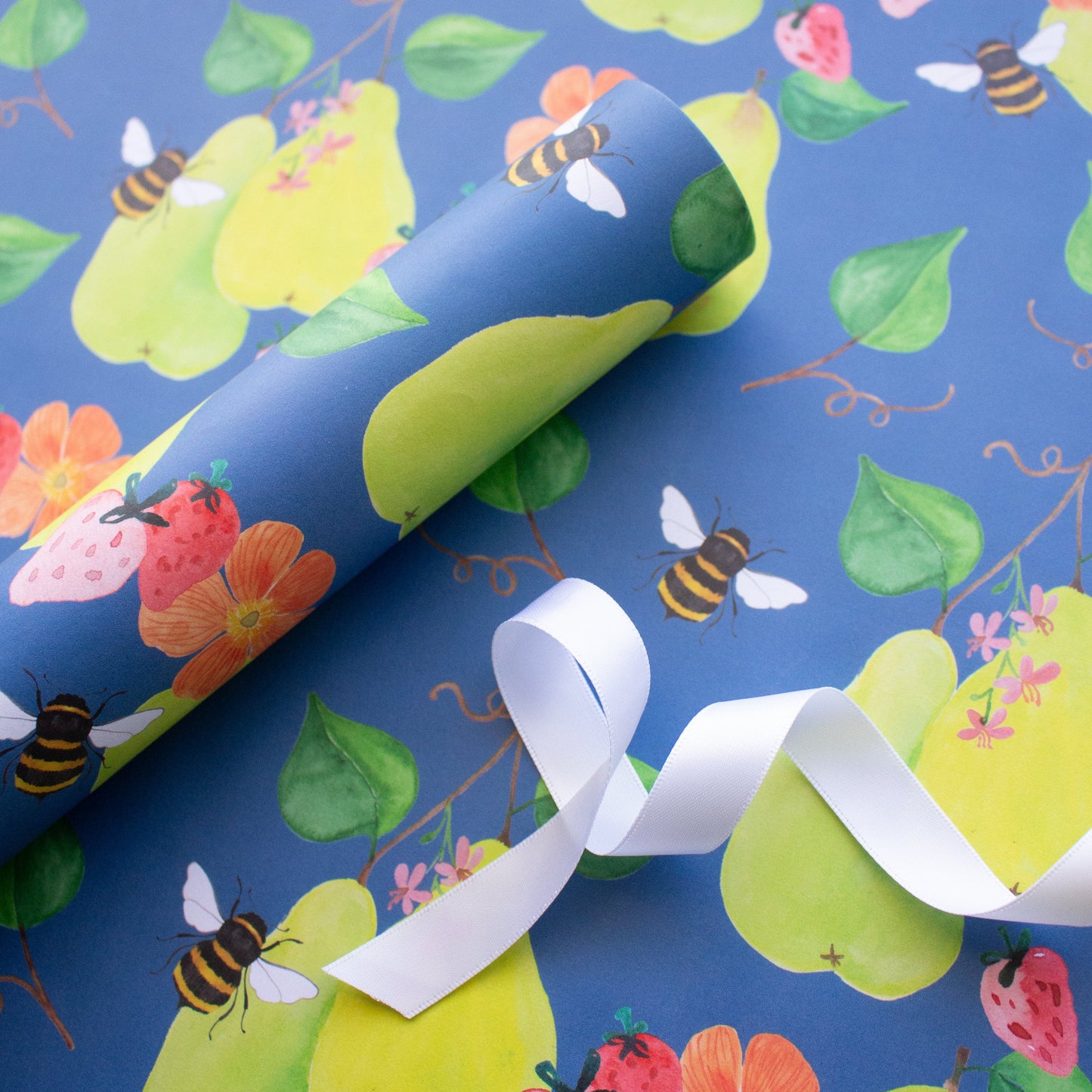 wrapping paper roll with white ribbon