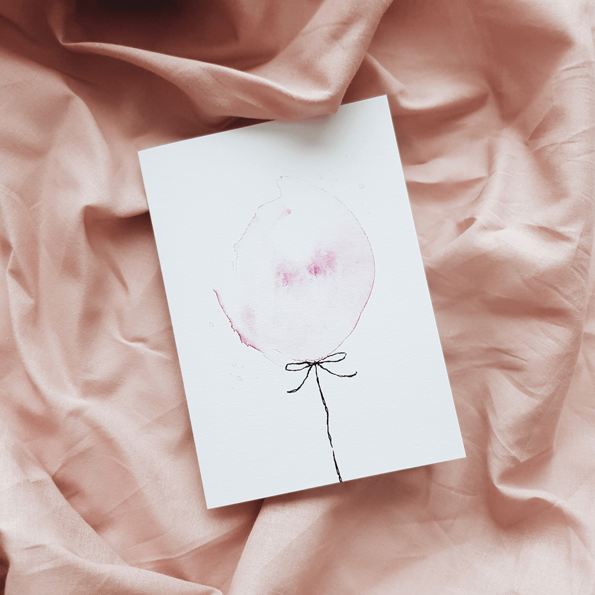Pink balloon greeting card on pink sheet background