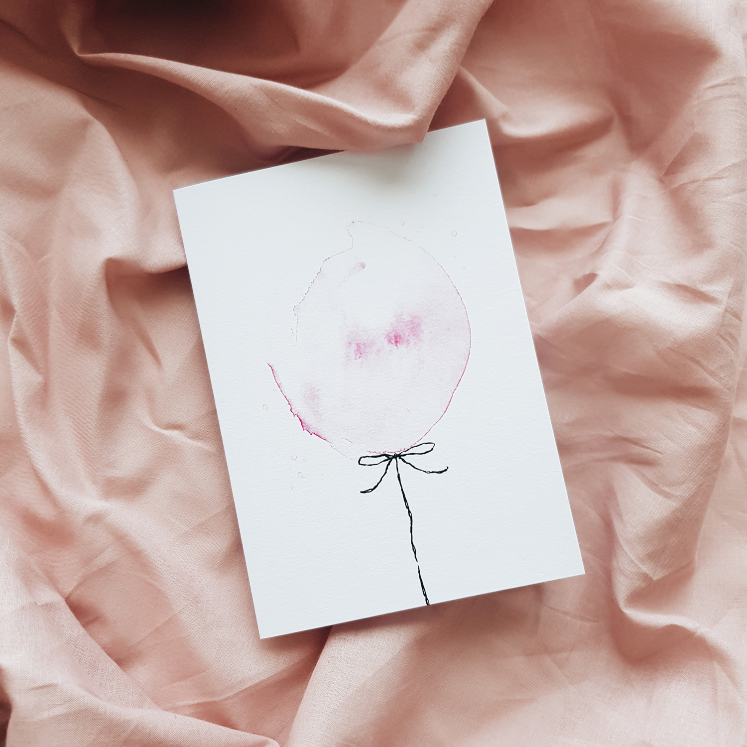 Pink balloon greeting card on pink sheet background