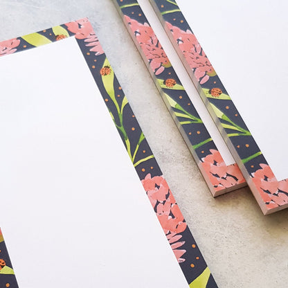 close up of blank pink banksia notepads