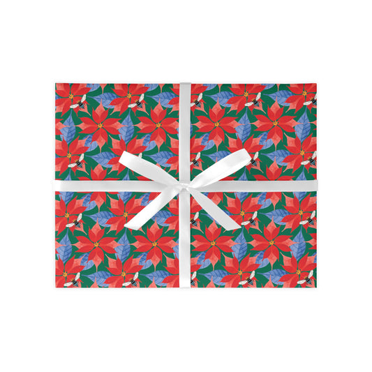 A colourful Poinsettia gift wrap sheet with a floral pattern, featuring a white ribbon for easy wrapping.