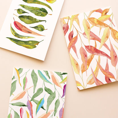 Colourful Australian gum leaf patterns cards against a beige background