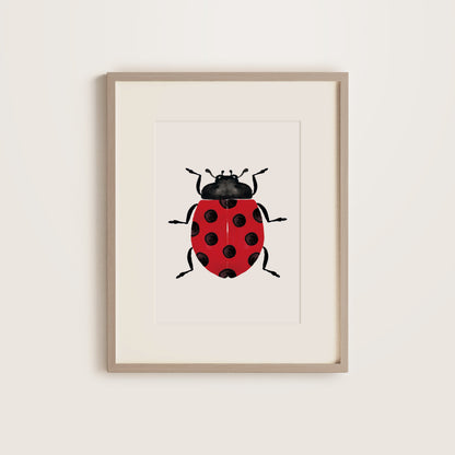 Framed artwork of a ladybug on a white background