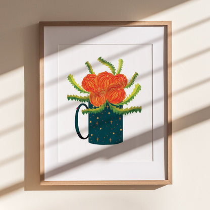 wooden framed print of red flowers, green zig zag leaves in a starry mug