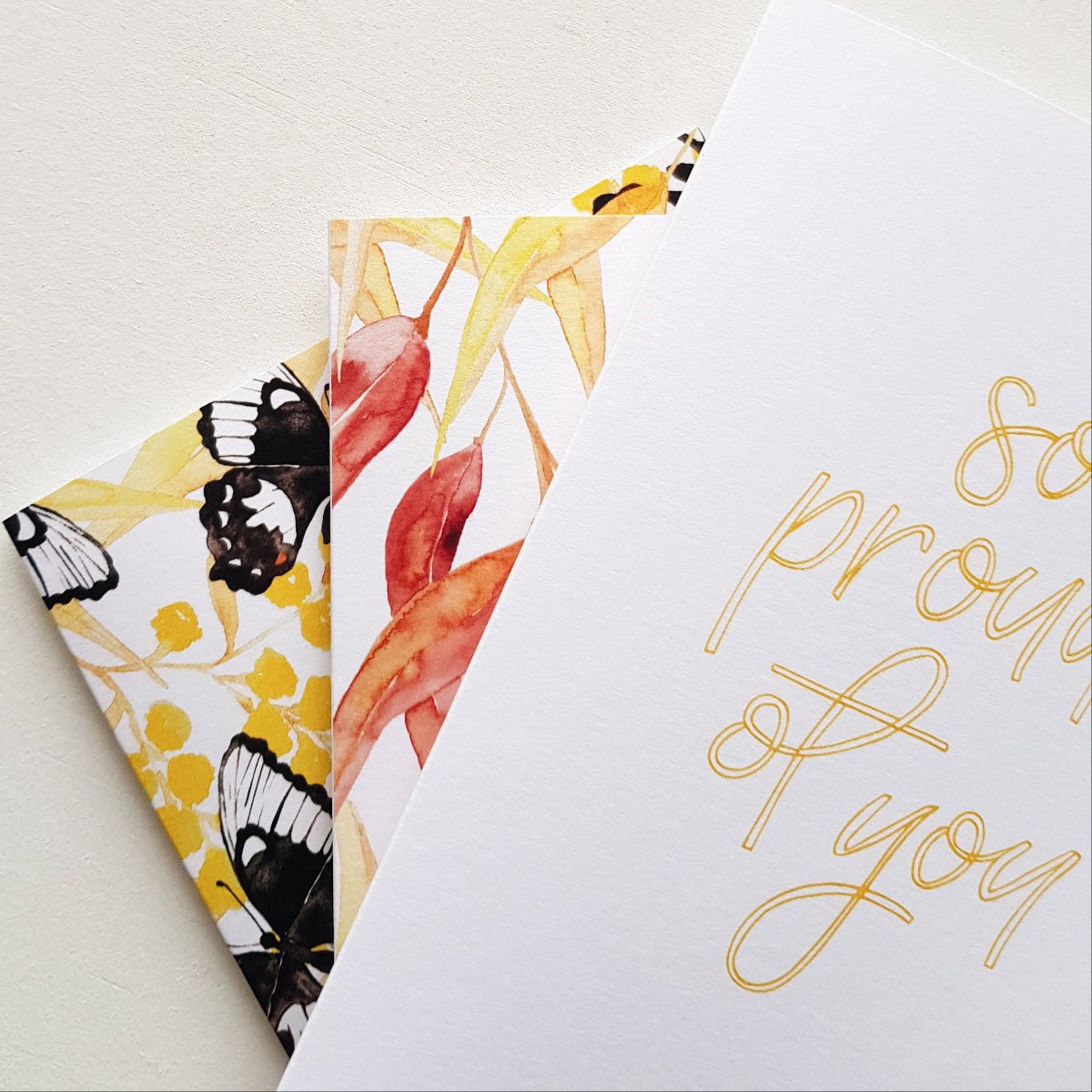 close up of three greeting cards on a whtie background