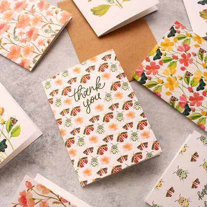 Pink floral thank you card with illustrated insects
