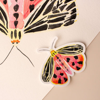 Pink moth sticker illustration on a beige background