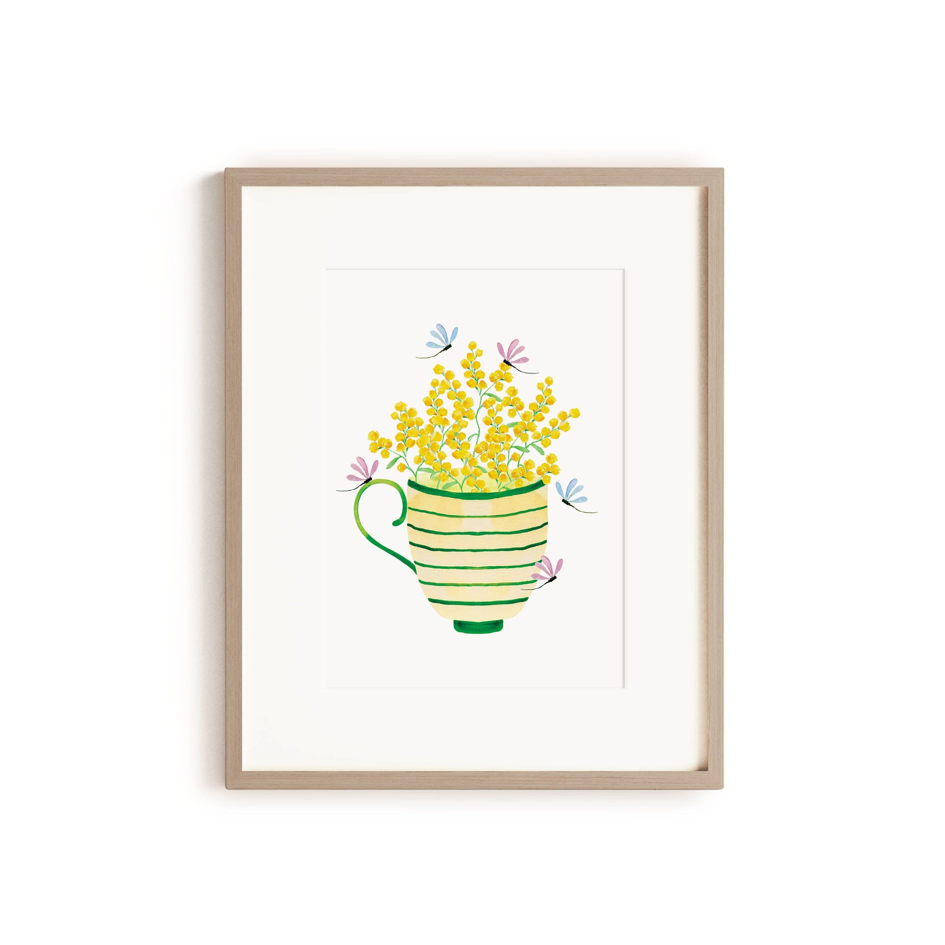 wooden framed artwork with striped tea cup filled with wattle flowers and dragonflies
