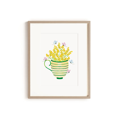 wooden framed artwork with striped tea cup filled with wattle flowers and dragonflies
