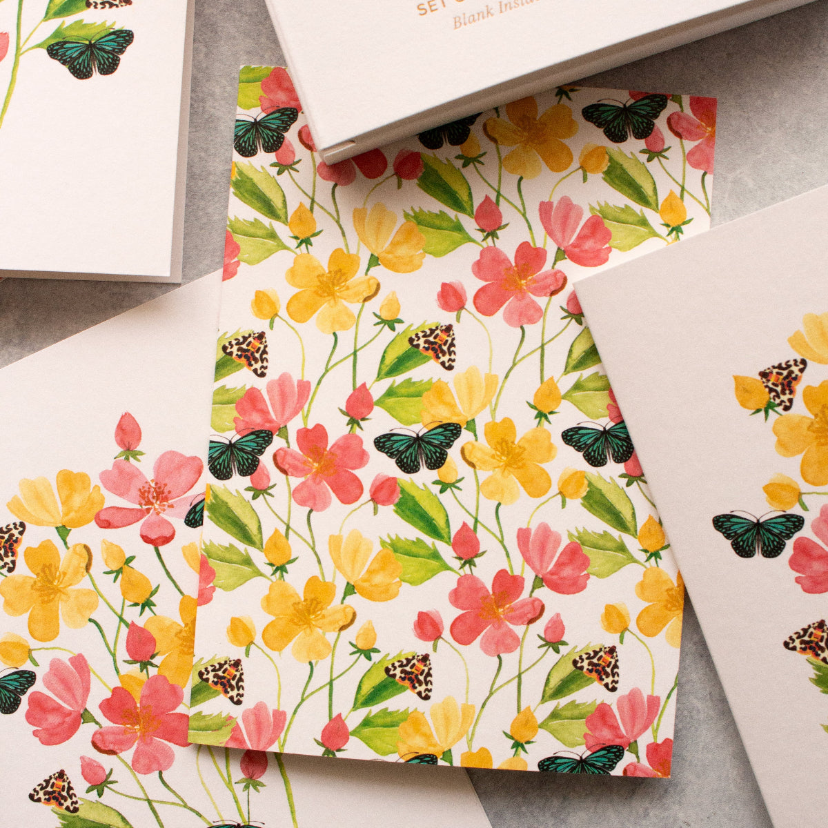 Watercolour greeting card with blue tiger butterfly among blooming wildflowers