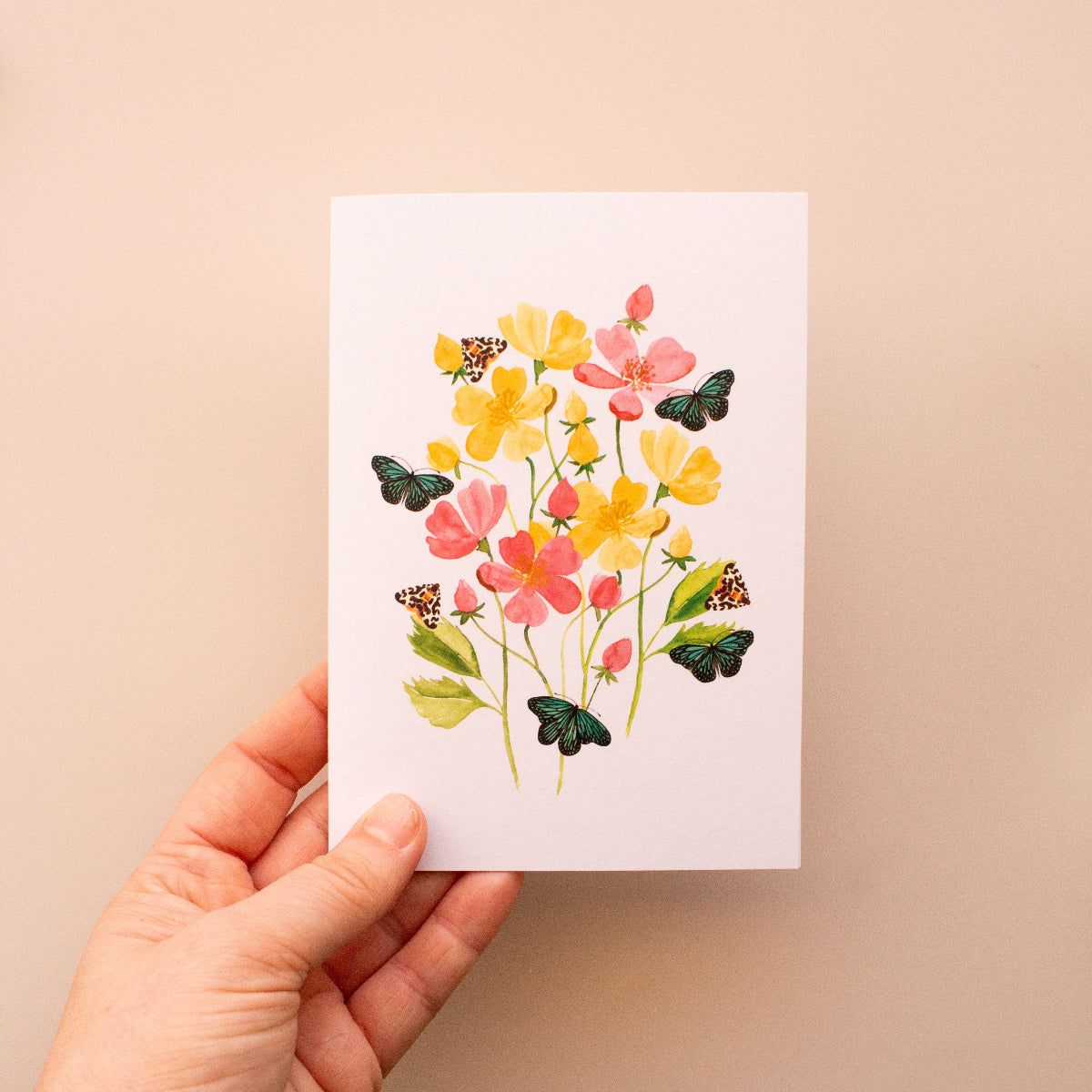 Handcrafted botanical card with vibrant floral and butterfly illustrations