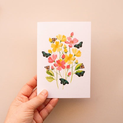Handcrafted botanical card with vibrant floral and butterfly illustrations