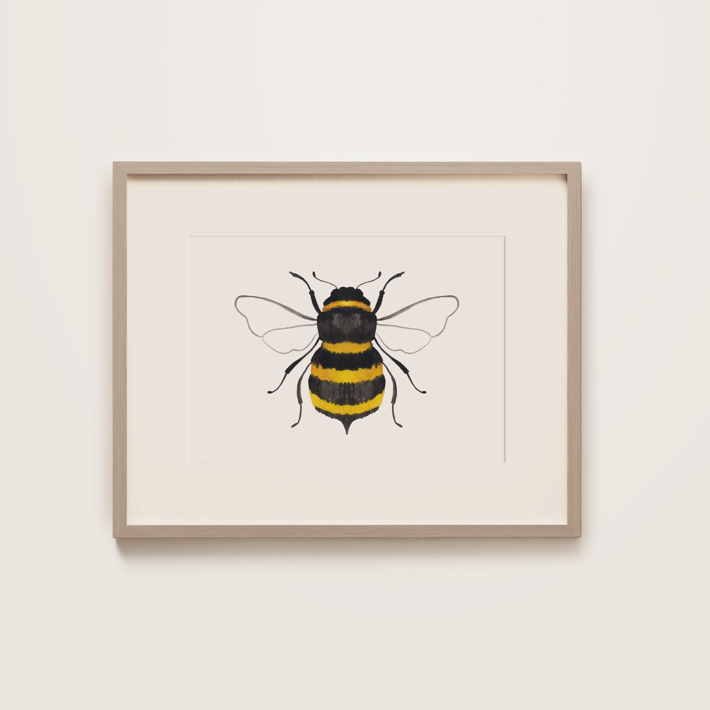 Framed artwork of a bee on a white background