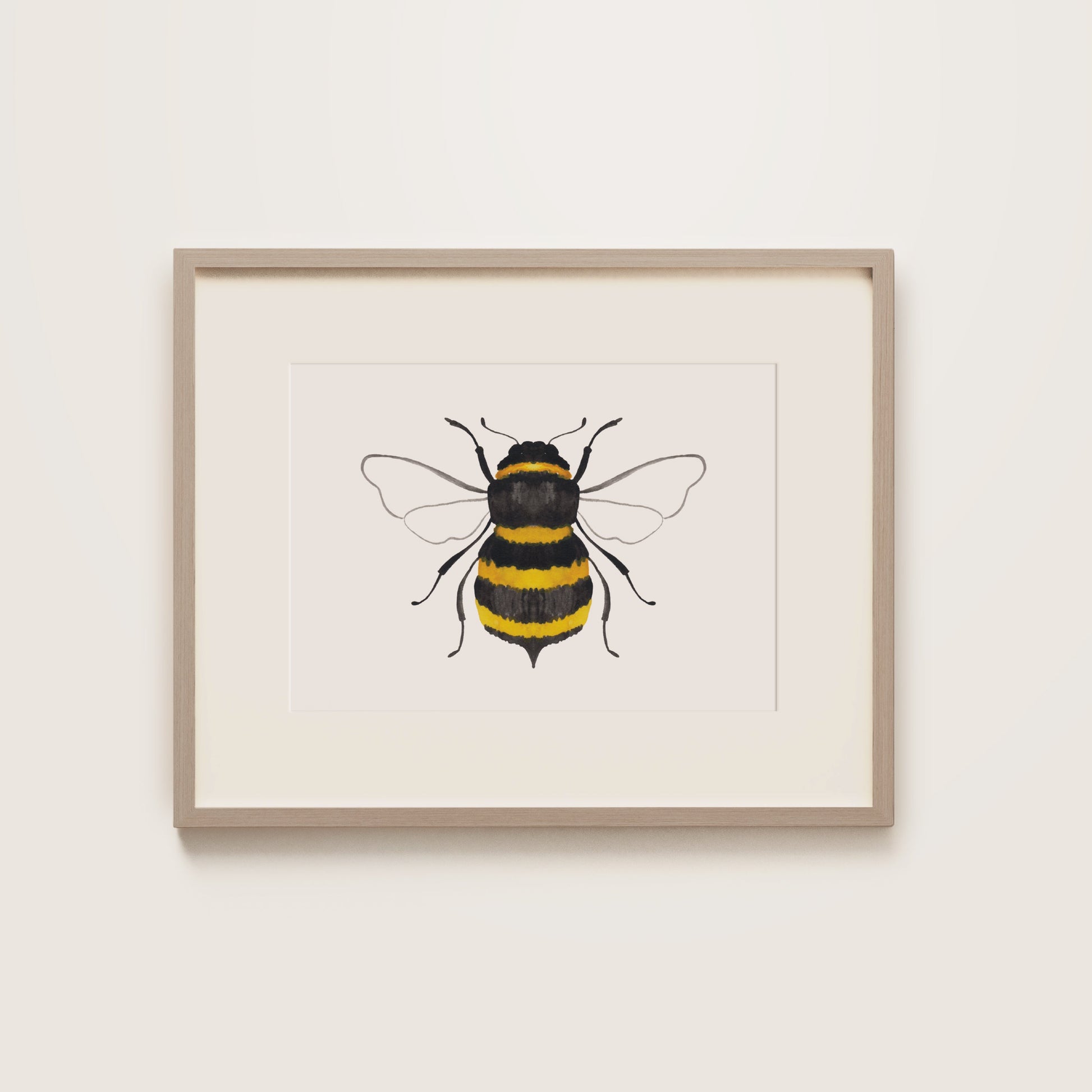 Framed artwork of a bee on a white background