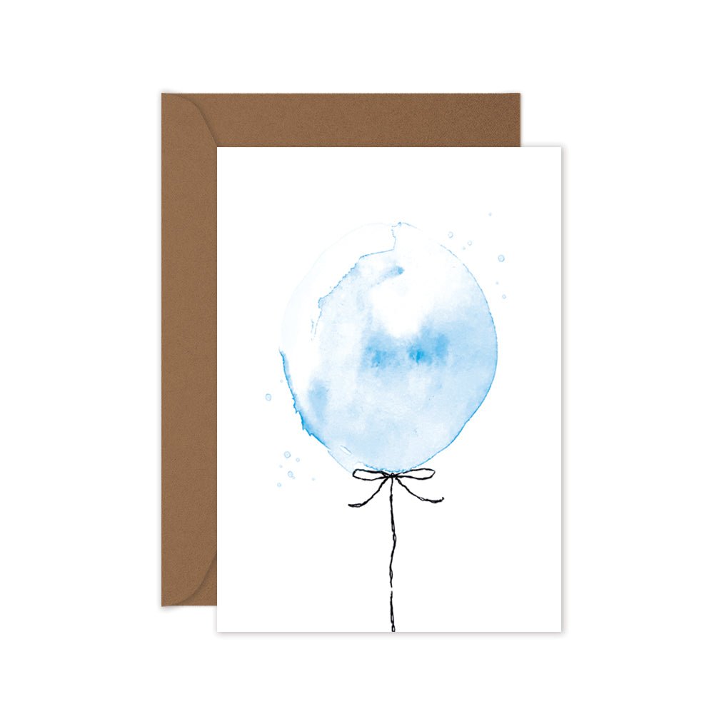 A greeting card with a hand painted blue balloon illustration, accompanied by a brown kraft envelope.